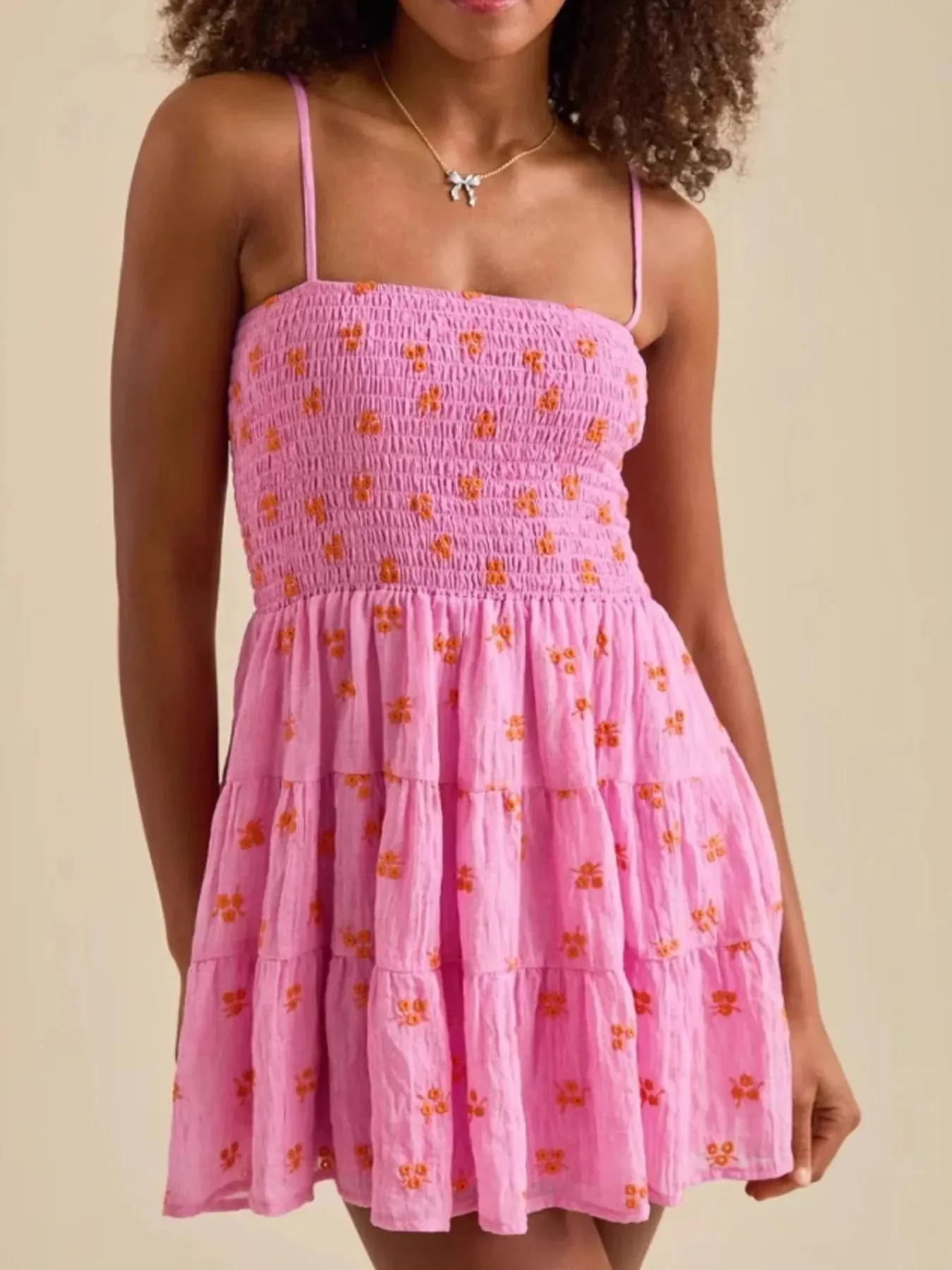 Floral Smocked Tiered Mini Cami Dress sold by Charming Charlie