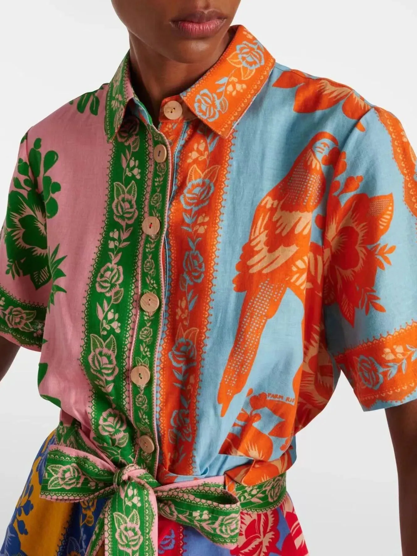 Printed Short Sleeve Tie Waist Romper sold by Charming Charlie