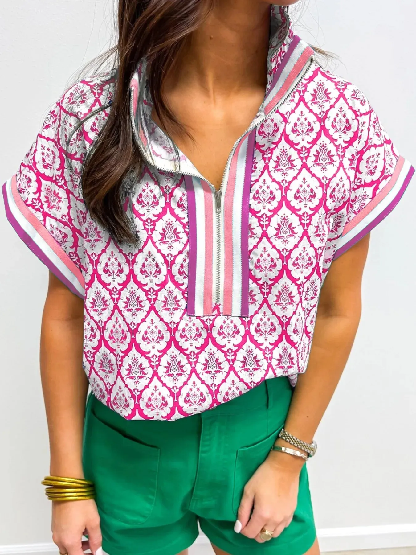 Printed Half Zip Short Sleeve Blouse sold by Charming Charlie