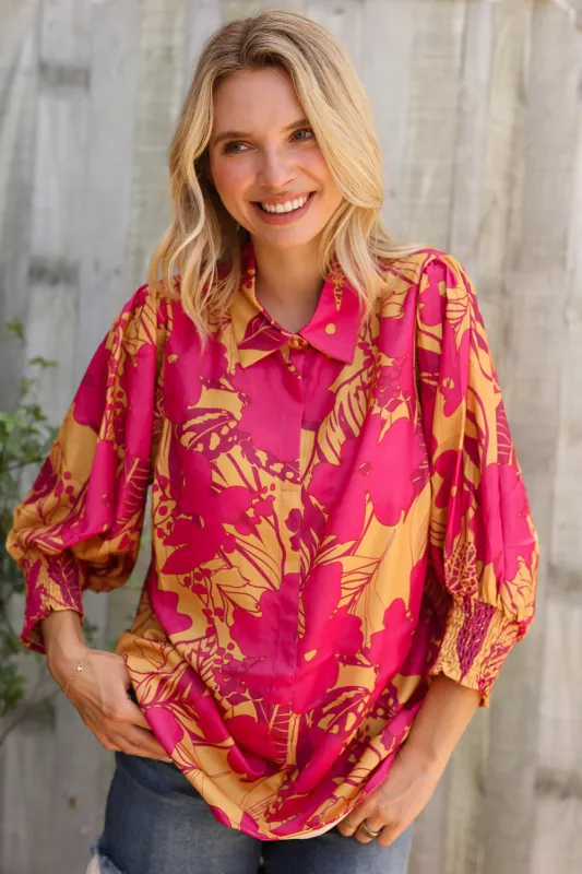 Elegant In Fuchsia Satin Button-Down Smock Long Sleeve Blouse sold by Charming Charlie