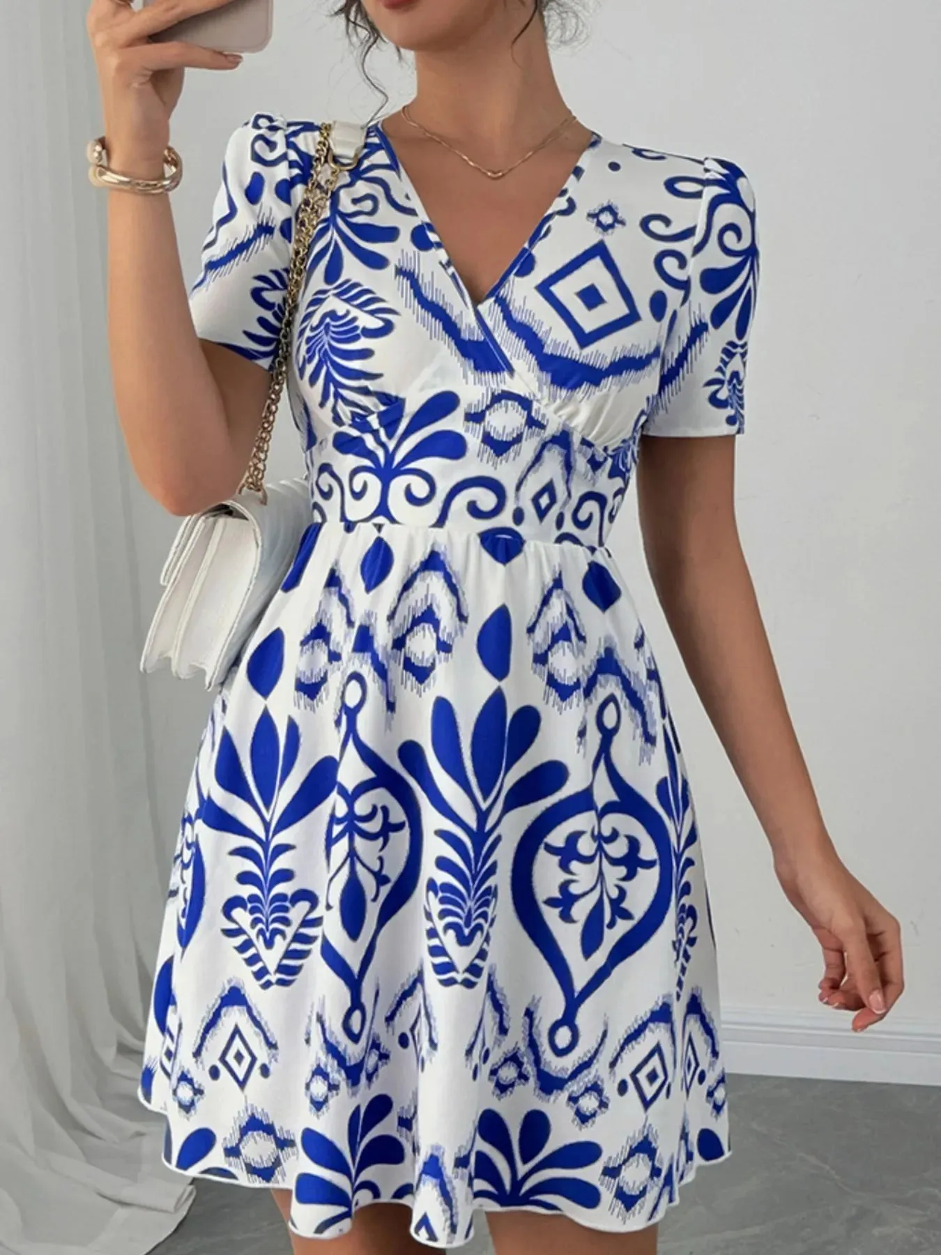 Printed Surplice Short Sleeve Dress sold by Charming Charlie