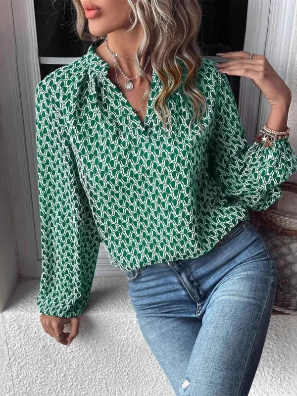 Printed Notched Long Sleeve Blouse sold by Charming Charlie