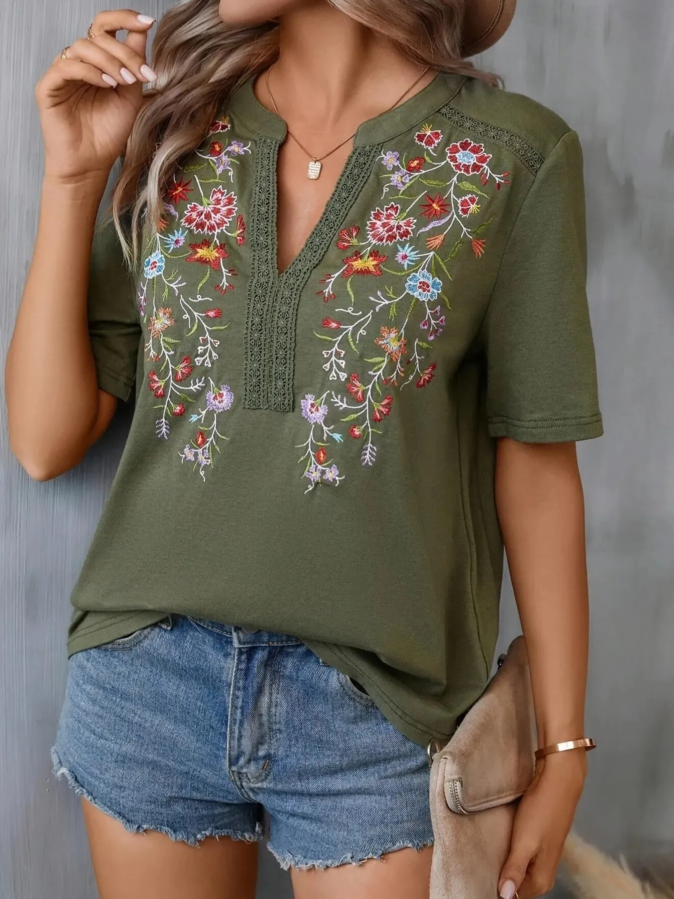 Embroidered Floral Notched Short Sleeve Blouse sold by Charming Charlie