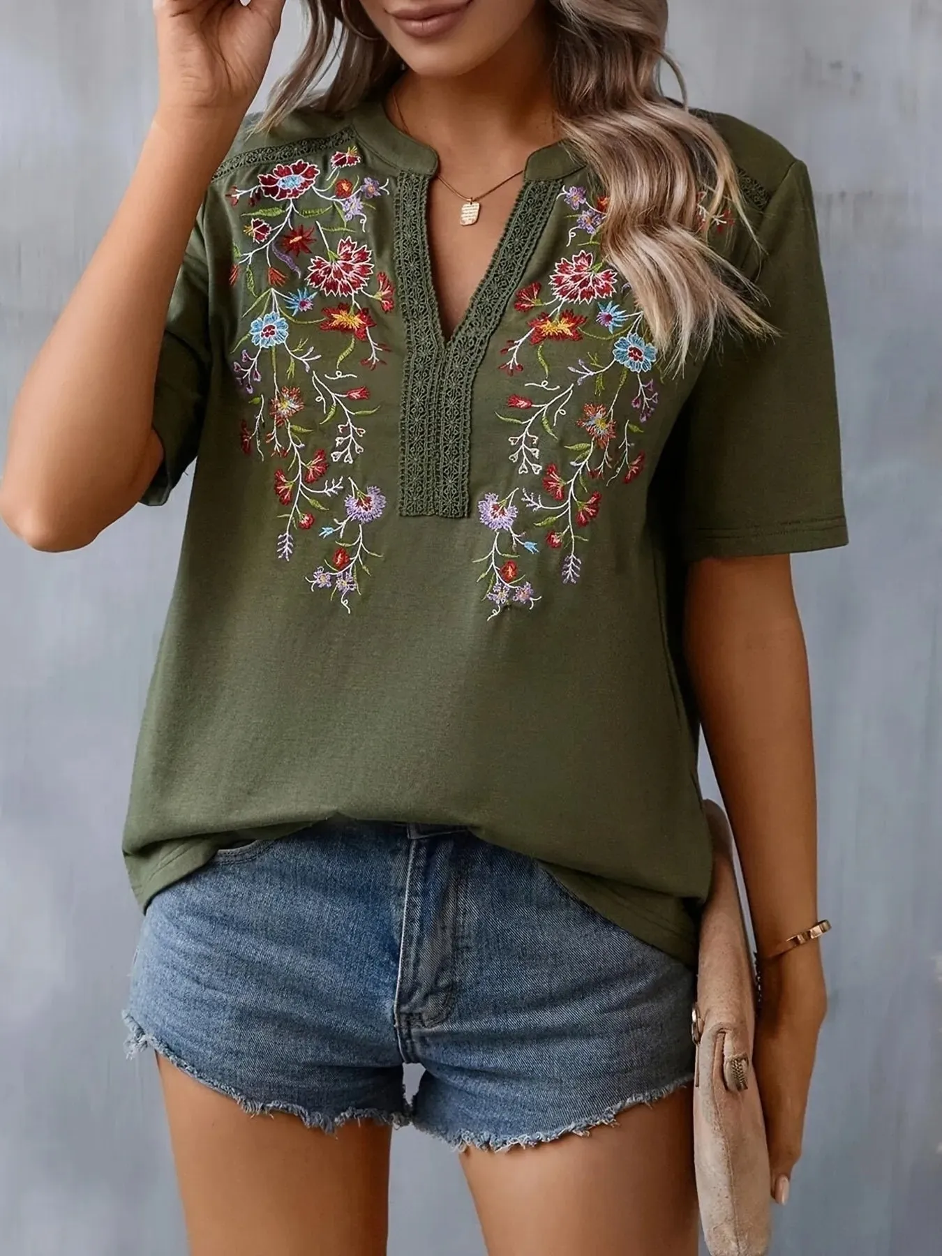 Embroidered Floral Notched Short Sleeve Blouse sold by Charming Charlie product image thumbnail 2
