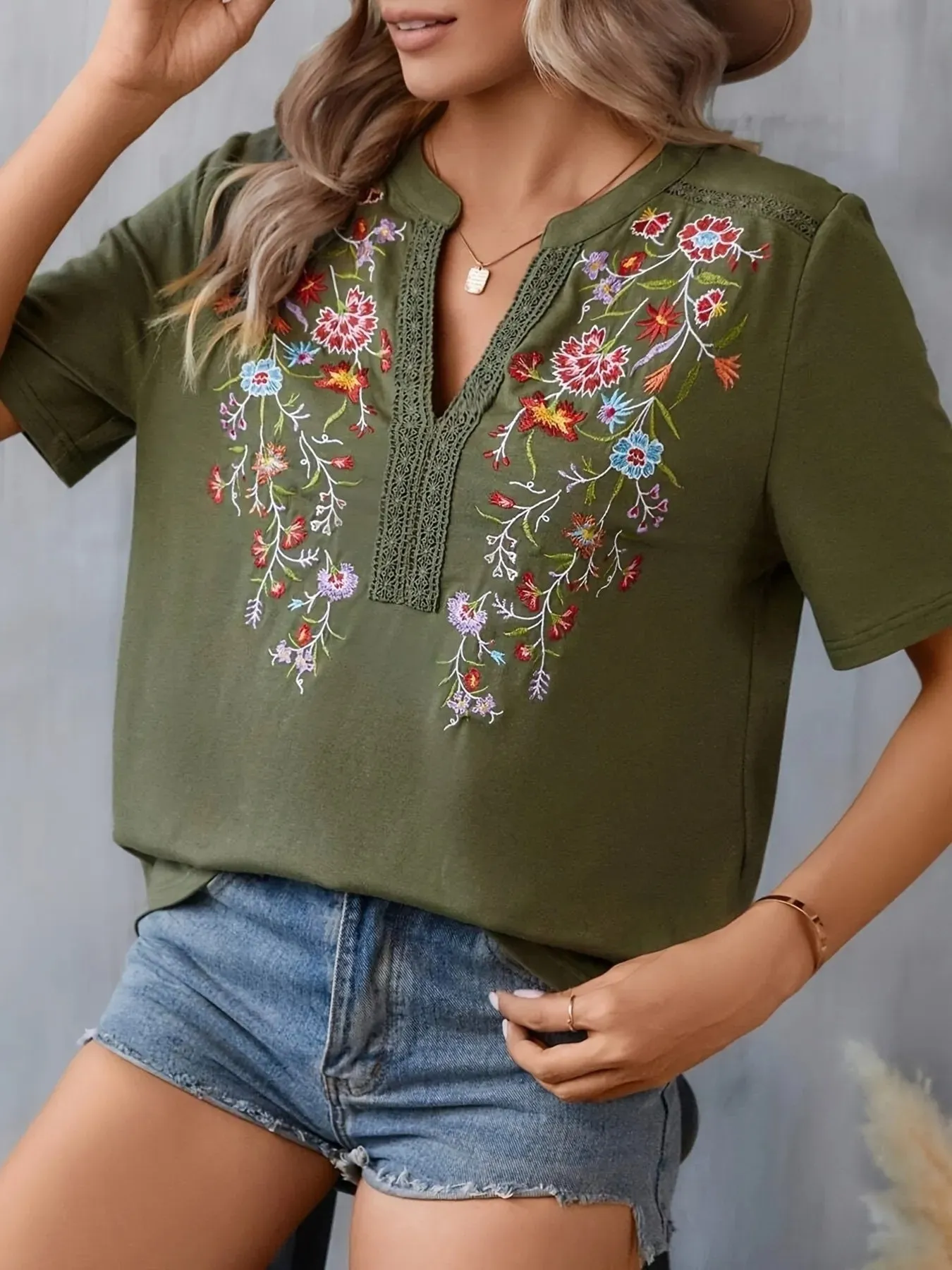 Embroidered Floral Notched Short Sleeve Blouse sold by Charming Charlie product image thumbnail 3