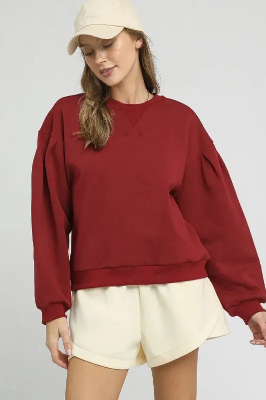 Umgee Round Neck Sweatshirt with Pleated Detail sold by Charming Charlie