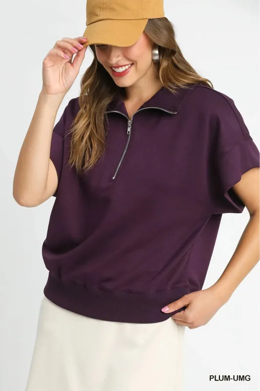 Umgee Full Size Half-Zip Short Sleeve Top Plus Size sold by Charming Charlie