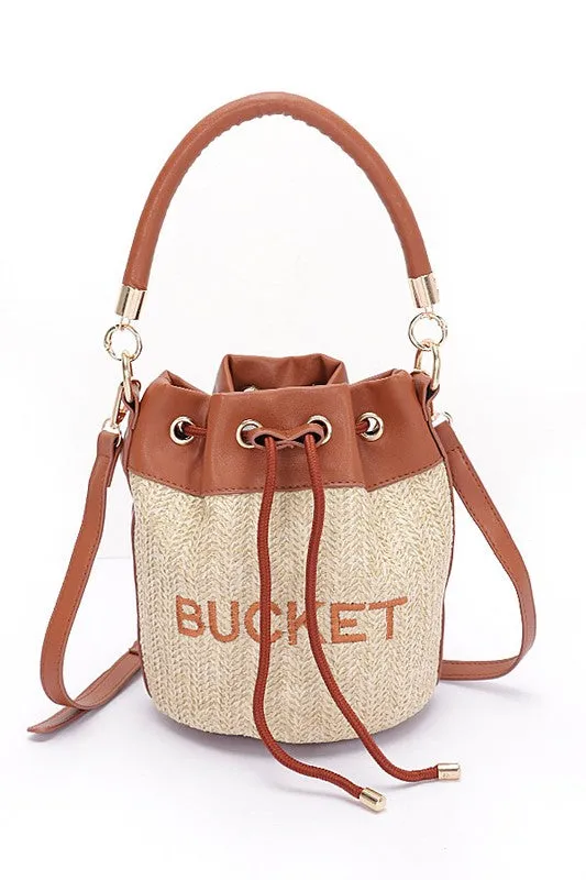 Top Handle Faux Straw Bucket Bag sold by Charming Charlie