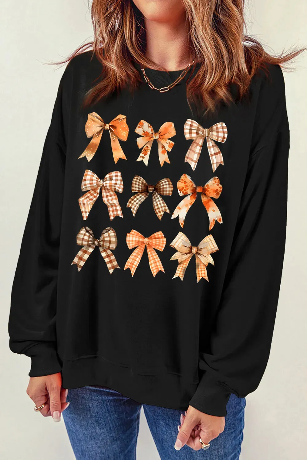 Bow Graphic Round Neck Long Sleeve Sweatshirt sold by Charming Charlie