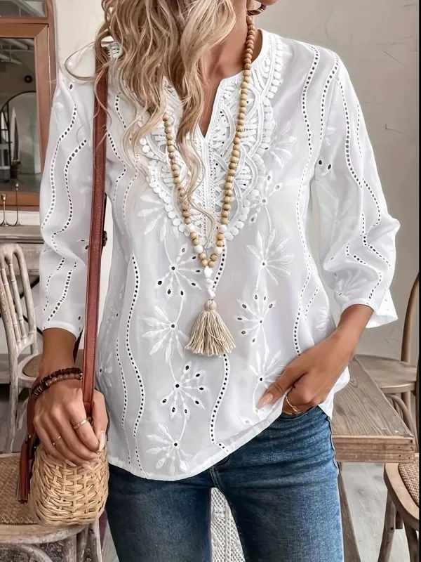 Eyelet Embroidered Notched Blouse sold by Charming Charlie