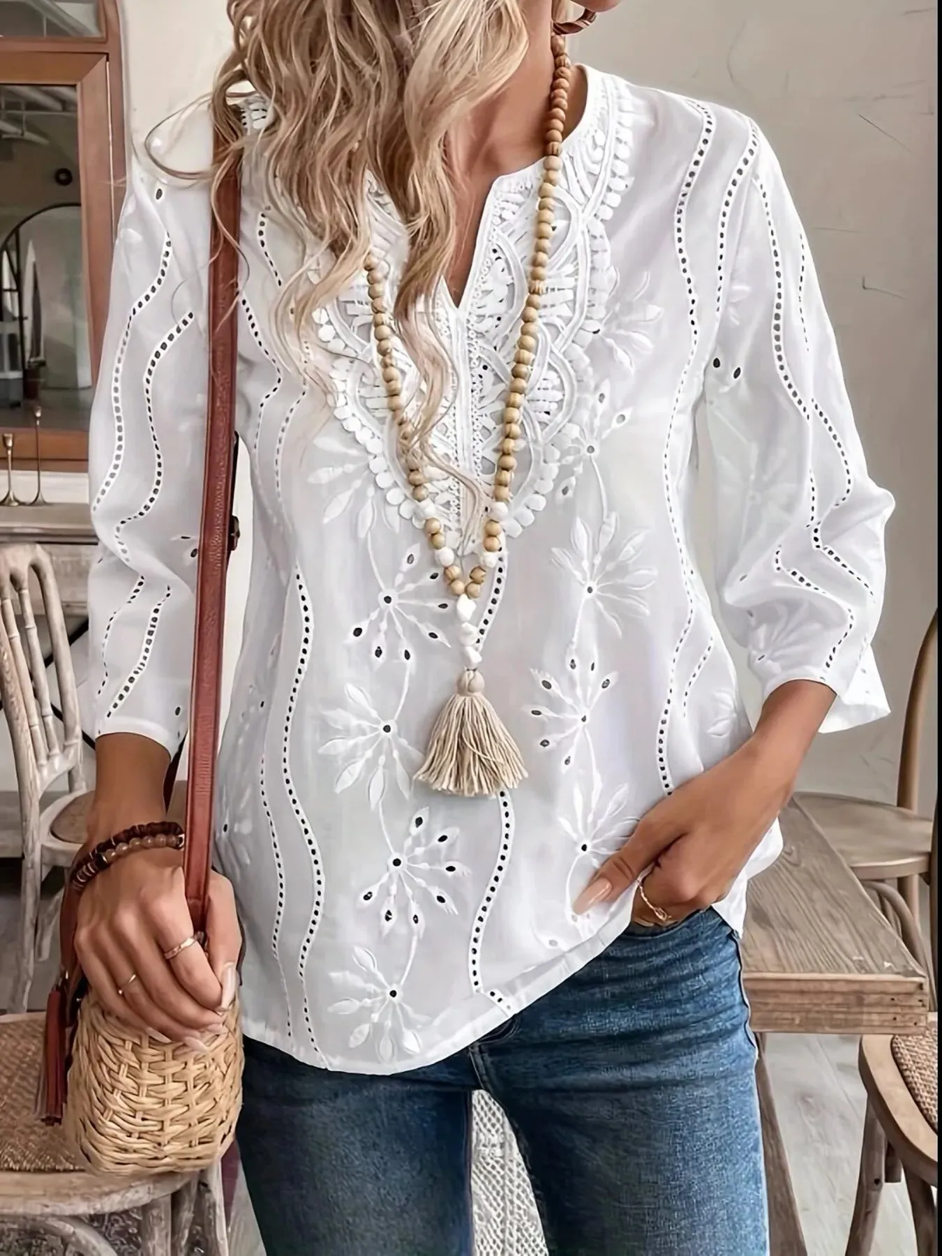 Eyelet Embroidered Notched Blouse sold by Charming Charlie