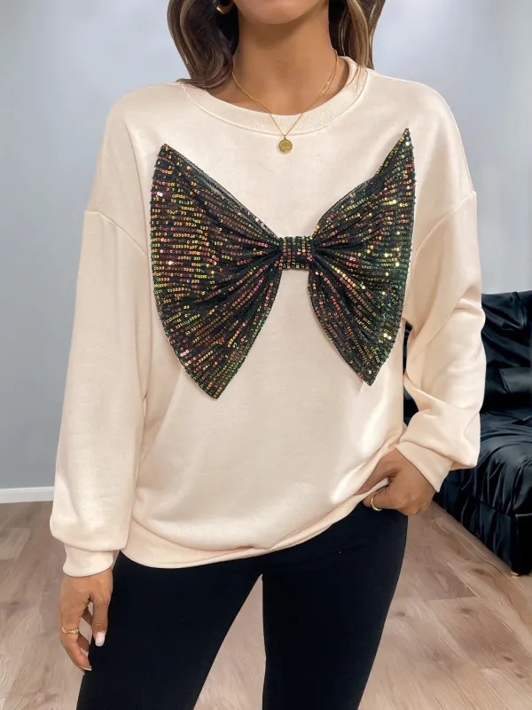 Sequined Bow Round Neck Sweatshirt sold by Charming Charlie