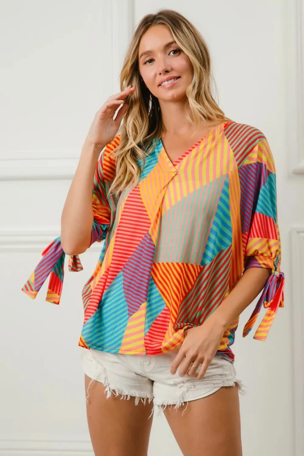 BiBi Multi Stripe Block Printed Jersey Blouse with Tied Sleeves sold by Charming Charlie