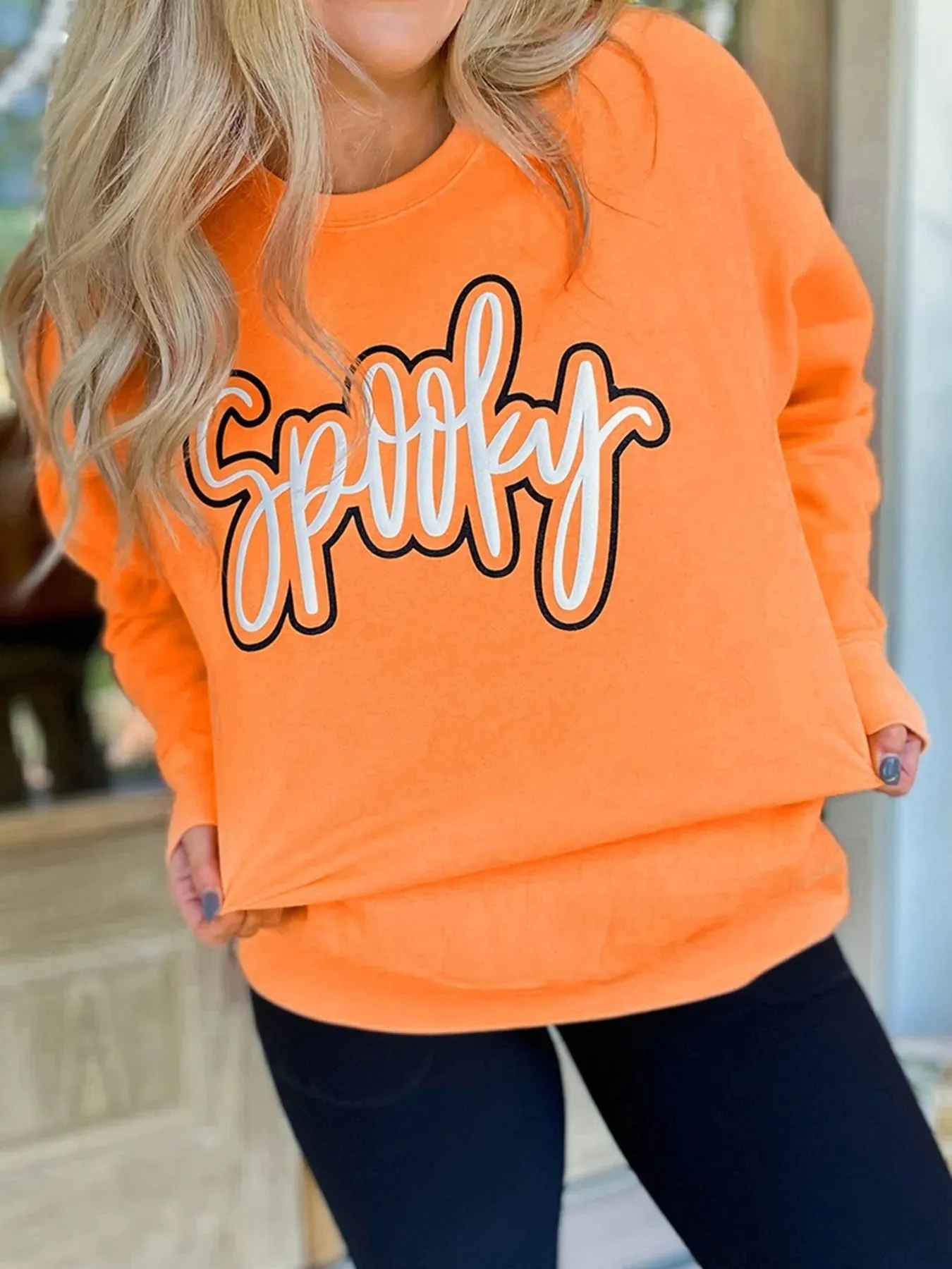 Spooky Round Neck Long Sleeve Sweatshirt sold by Charming Charlie