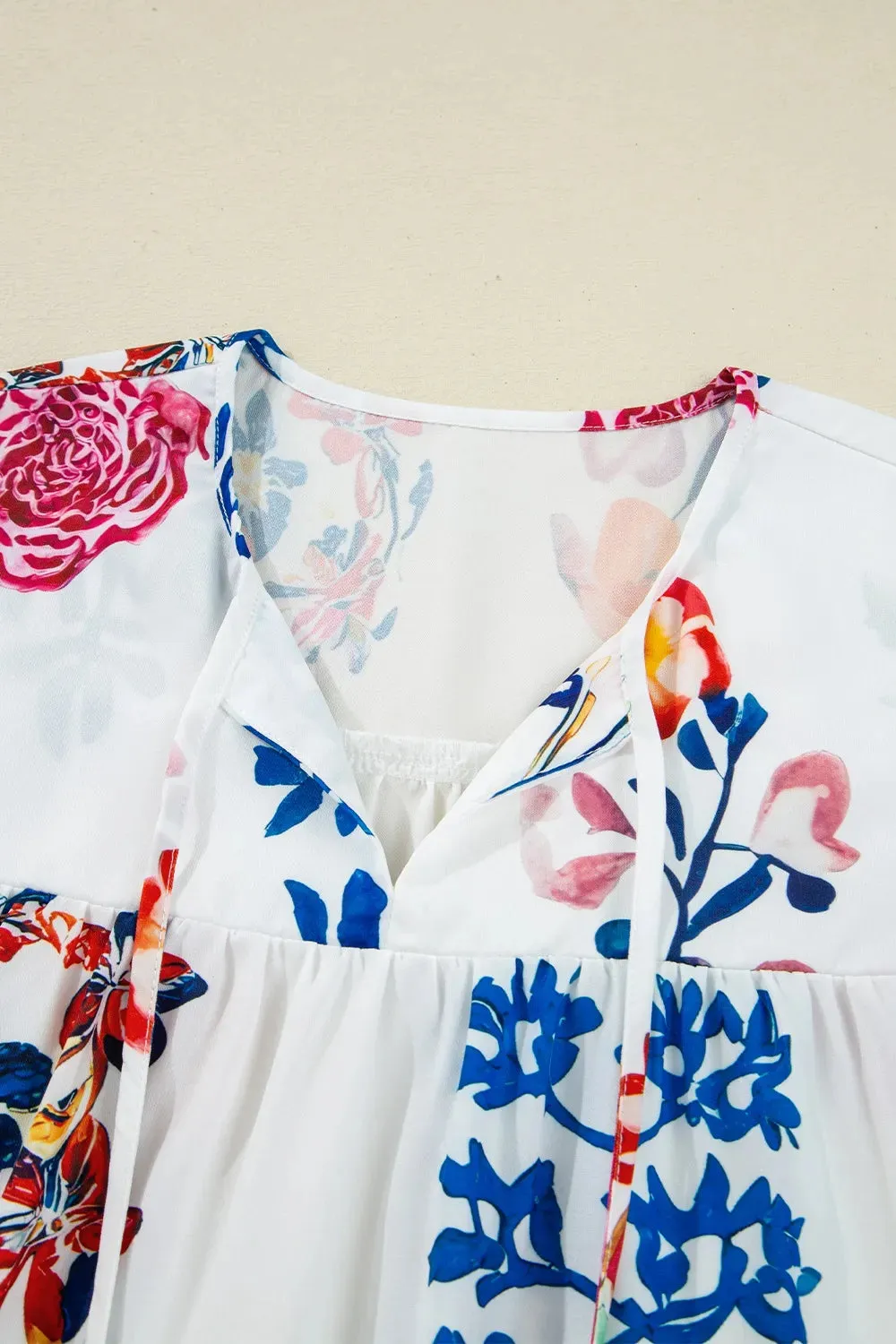 Printed Tie Neck 3/4 Sleeve Blouse sold by Charming Charlie product image thumbnail 4