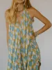 Asymmetrical Hem Printed Halter Neck Dress sold by Charming Charlie