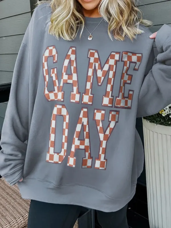 Game Day Checkered Oversized Sweatshirt sold by Charming Charlie