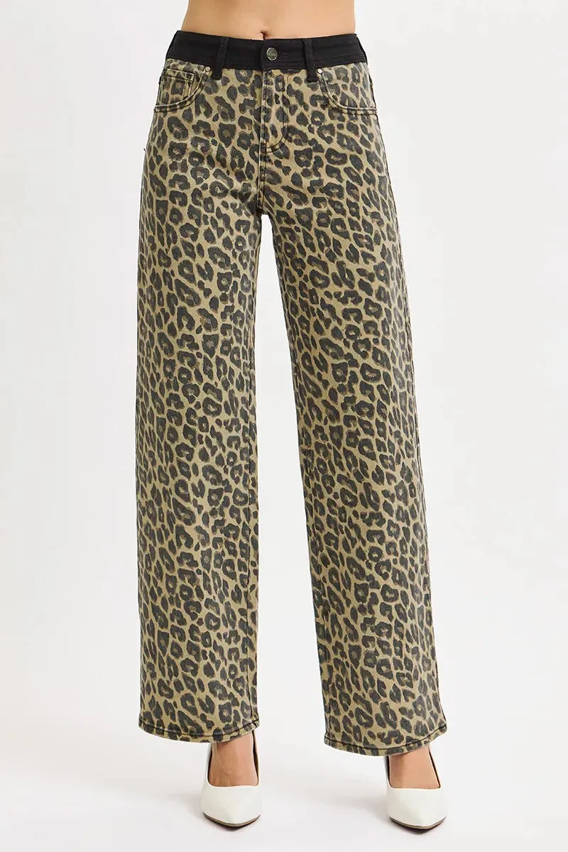 RISEN High Rise Wide Leg Leopard Printed Jeans with Contrast Waist Band Detail sold by Charming Charlie