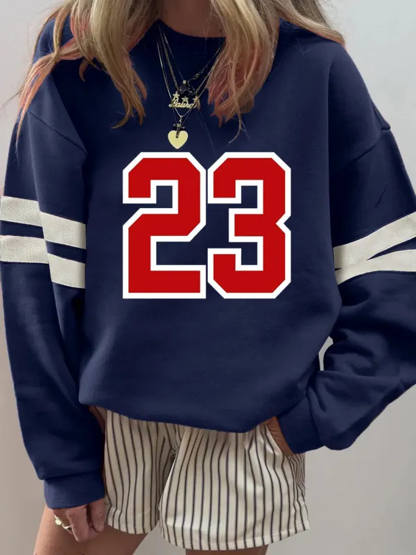 Number 23 Graphic Sweatshirt with Side Stripes sold by Charming Charlie