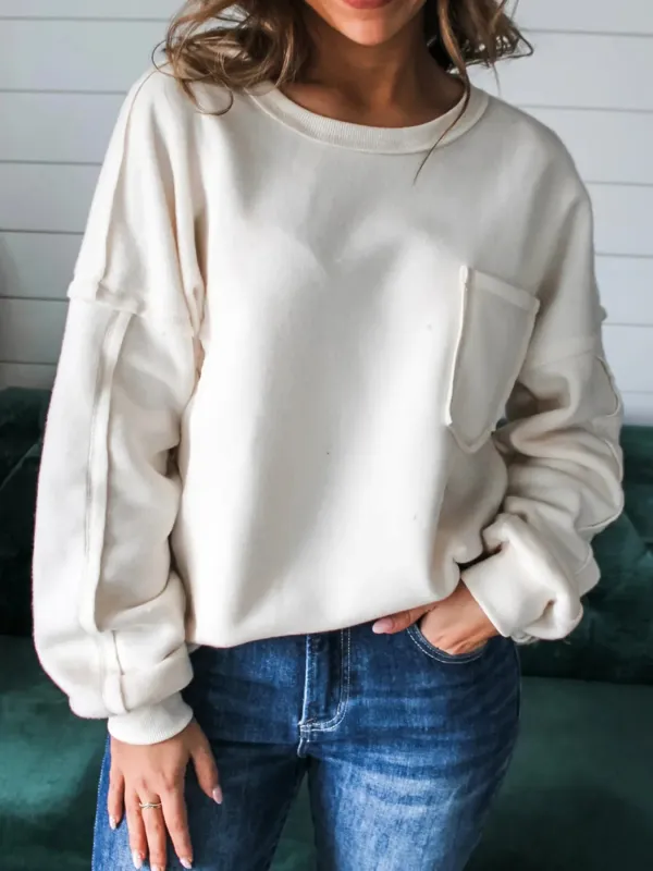 Exposed Seam Chest Pocket Knit Pullover Sweatshirt sold by Charming Charlie