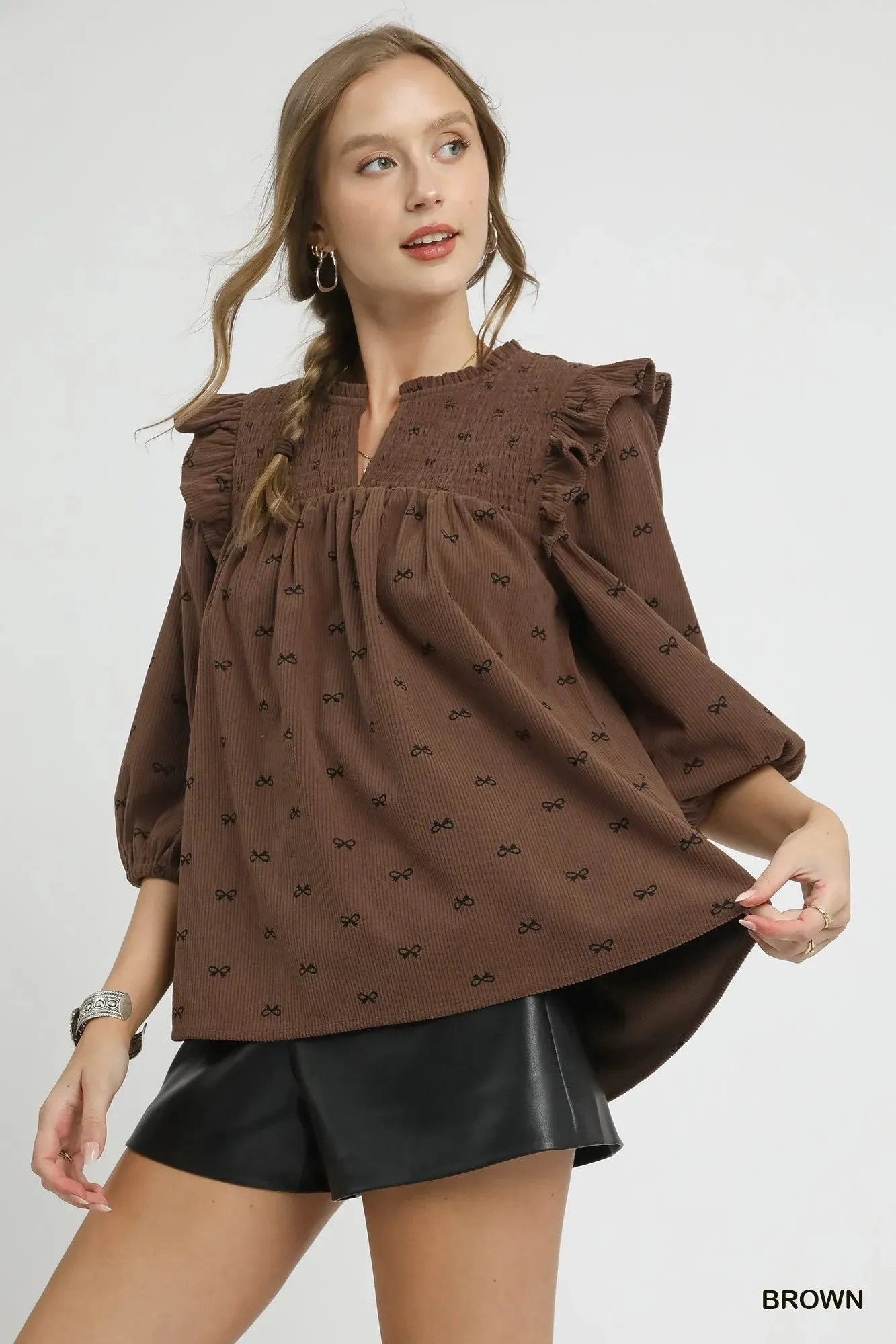 Umgee Bow Print Corduroy Puff Sleeve Blouse with Ruffled sold by Charming Charlie