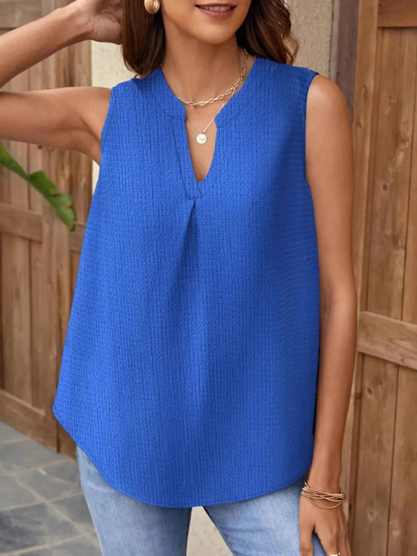 Notched Solid Color Tank sold by Charming Charlie