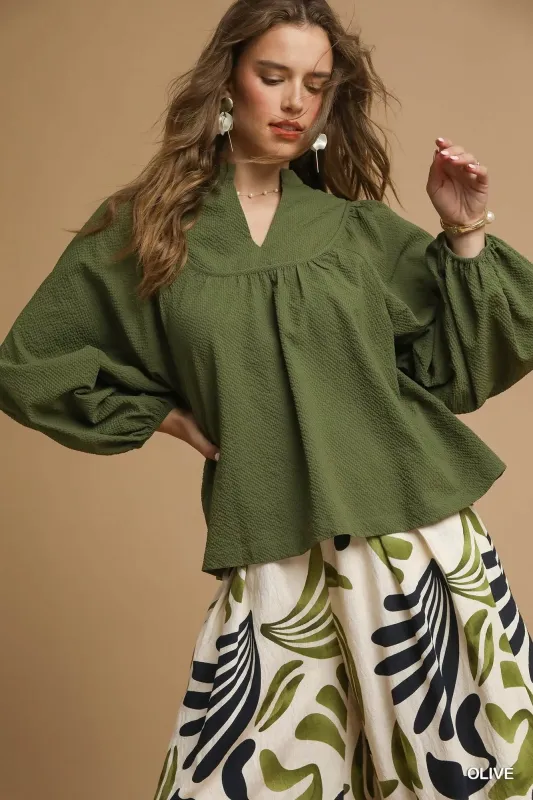 Umgee Textured Notched Blouse with Balloon Sleeves sold by Charming Charlie