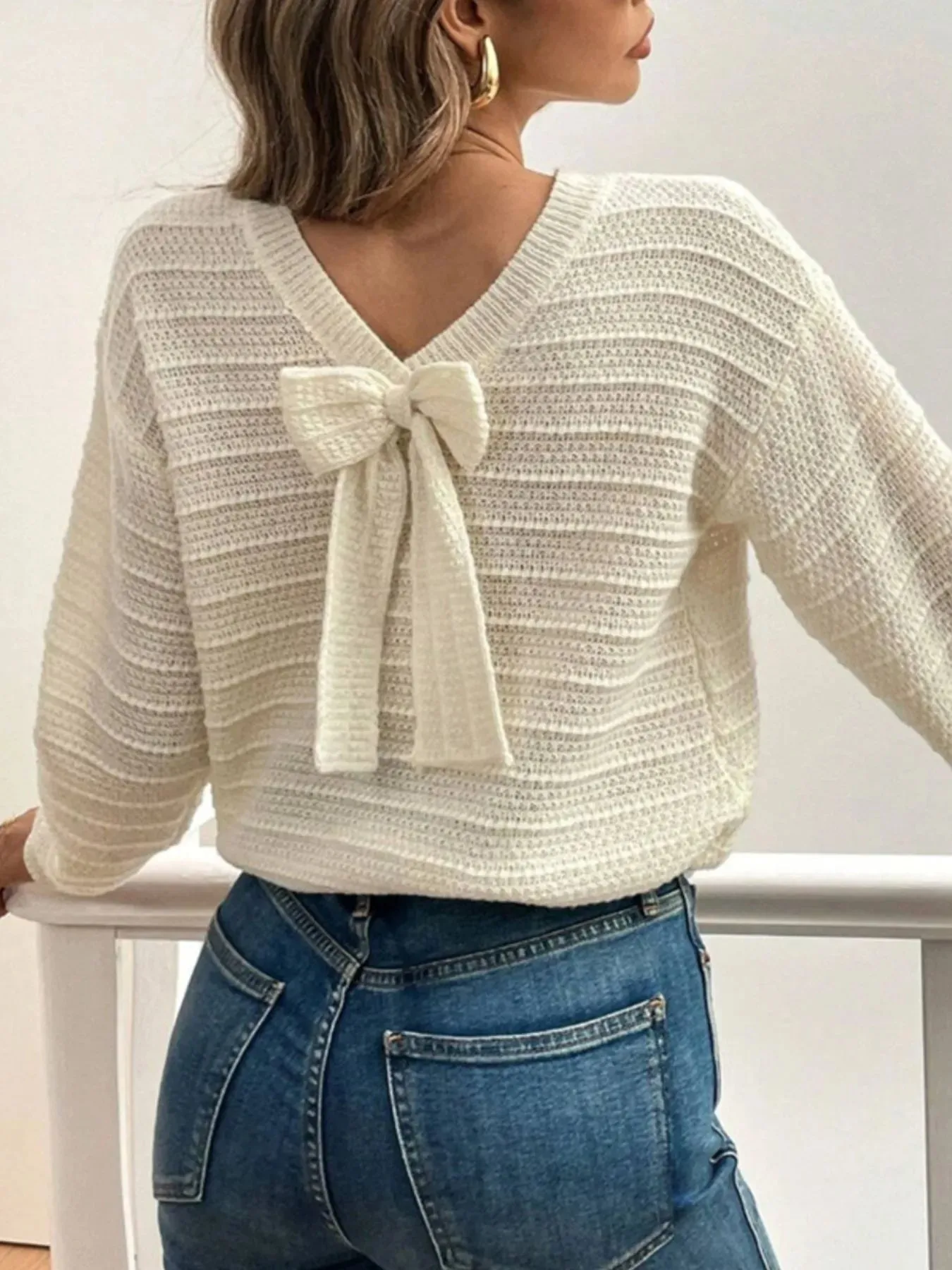 Round Neck Bow-Back Knit Top sold by Charming Charlie
