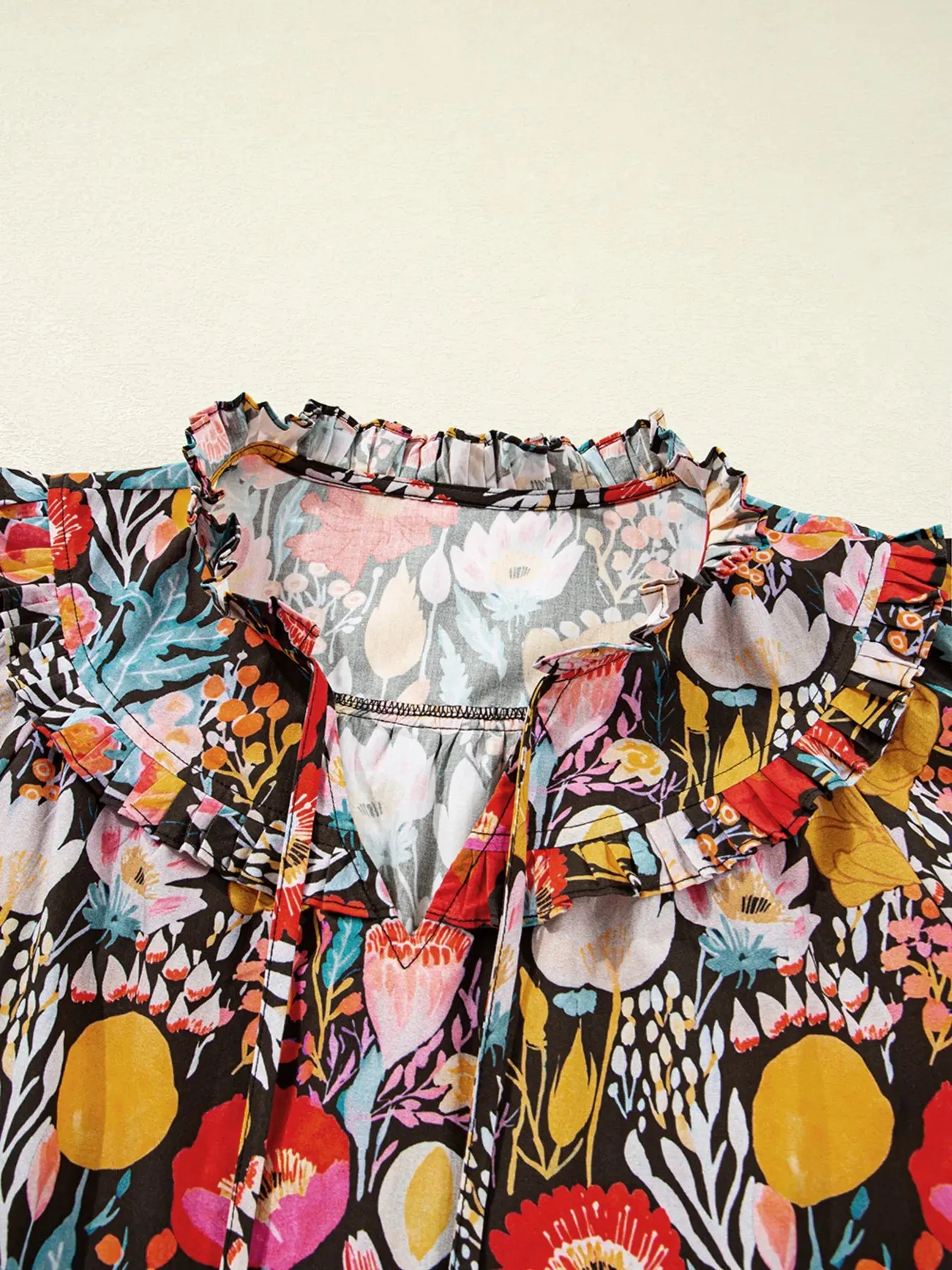 Floral 3/4 Puff Sleeve Tied Neck Blouse sold by Charming Charlie product image thumbnail 5