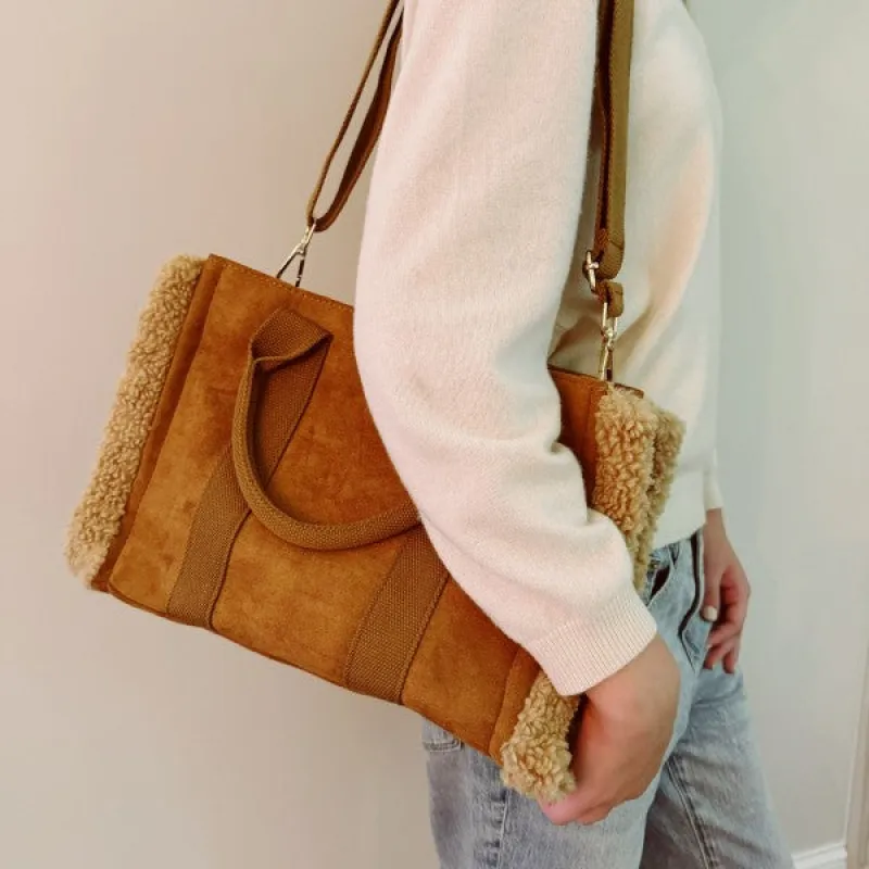 The Tote Crossbody Bag With Handles sold by Charming Charlie