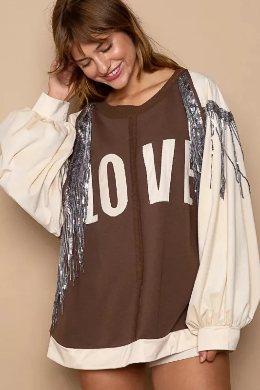 POL Balloon Sleeve French Terry Sweatshirt with Sequin Tassel sold by Charming Charlie