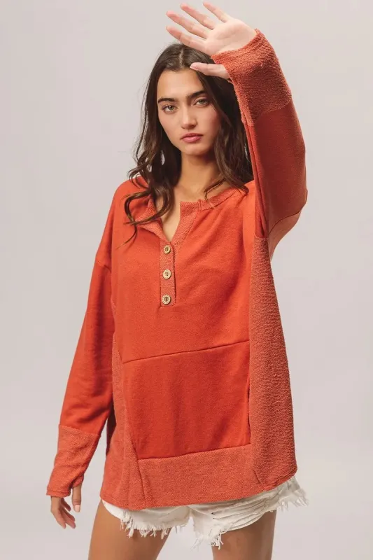 BiBi French Terry Knit Side Block Buttoned Henley Top sold by Charming Charlie