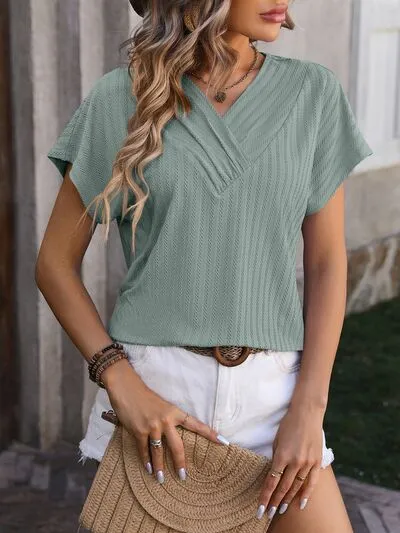 Textured Surplice Short Sleeve Blouse sold by Charming Charlie