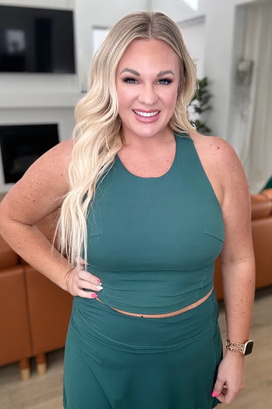 Get Moving Racer Back Crop Tank in Everglade Green sold by Charming Charlie