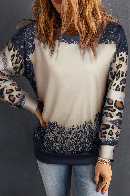Leopard Round Neck Long Sleeve Sweatshirt sold by Charming Charlie
