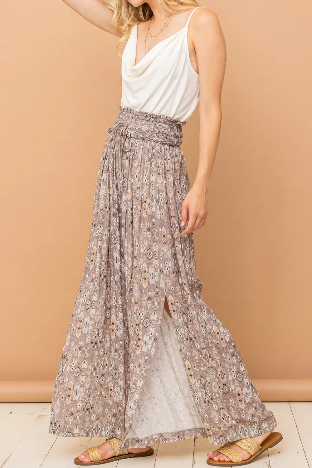And The Why Printed Smocked Waist Slit Wide Leg Pants sold by Charming Charlie