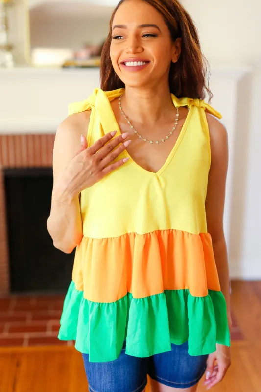 Yellow & Tangerine Tiered Shoulder Tie Crepe Top sold by Charming Charlie