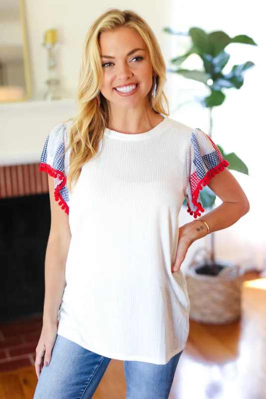 Patriotic Pom Pom Lace Flutter Sleeve Top sold by Charming Charlie
