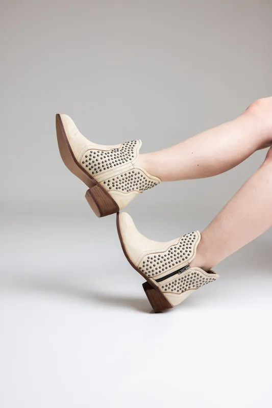 Nailed It Ankle Boot in White sold by Charming Charlie