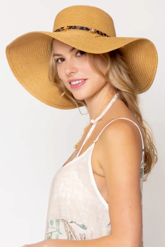 Straw Floppy Hat sold by Charming Charlie