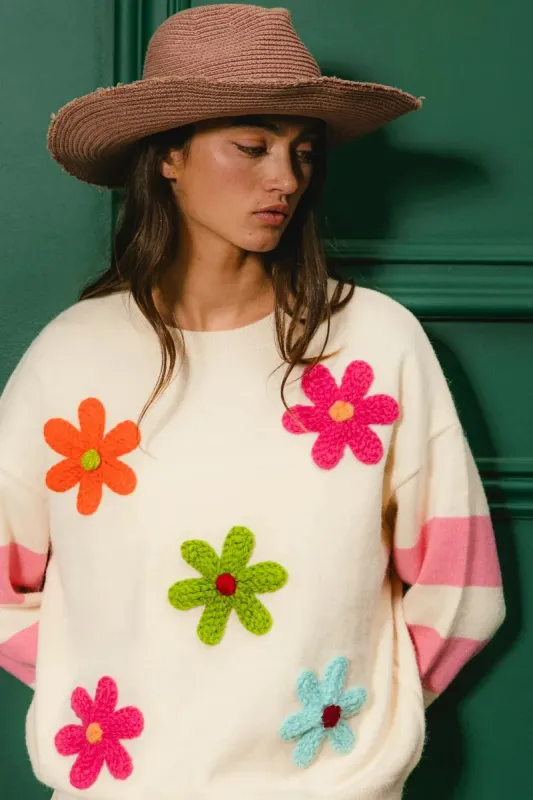 BiBi Colorful Floral Patched Sweater with Striped Sleeve sold by Charming Charlie