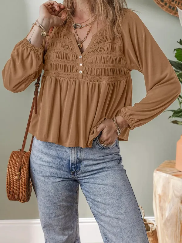 Smocked Buttoned Split V Neck Flow Fit Blouse sold by Charming Charlie