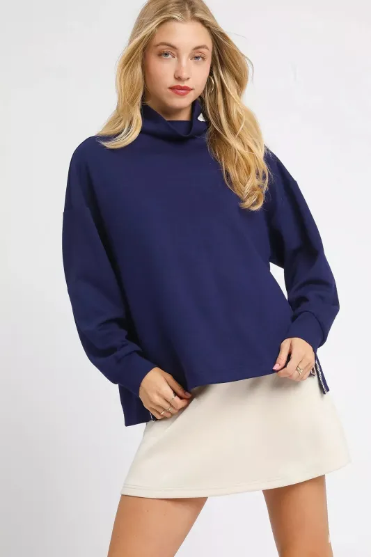Umgee Turtle Neck Dolman Sleeve Side Slit Sweater with Contrast Detail sold by Charming Charlie