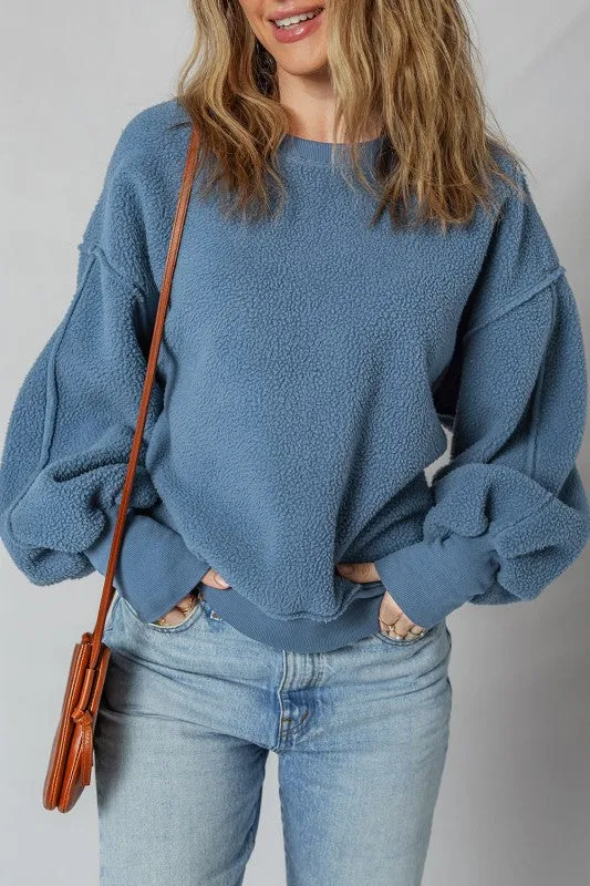Kinsley Fleece Exposed Seam Casual Sweatshirt sold by Charming Charlie