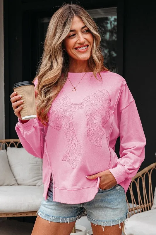 Brianna Lace Bow Embroidered Exposed Seam Sweatshi sold by Charming Charlie