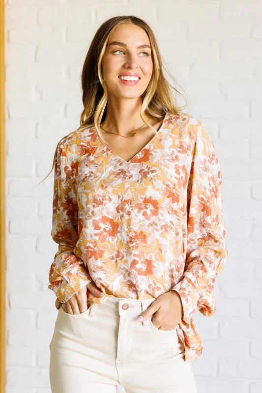 Marigold Dreams Floral Blouse sold by Charming Charlie