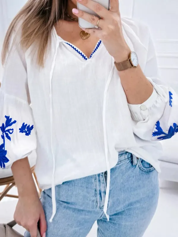 Floral Embroidered Tie Neck Blouse sold by Charming Charlie