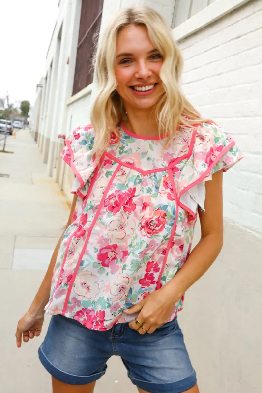 Southern Nights Pink Contrast Binding Floral Flutter Sleeve Top sold by Charming Charlie