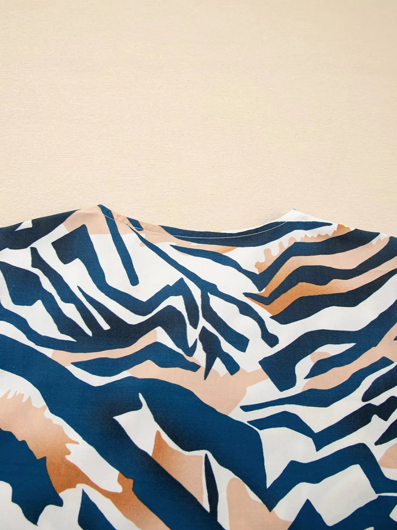 Zebra Print Tied Front Puff Sleeve Top sold by Charming Charlie product image thumbnail 5