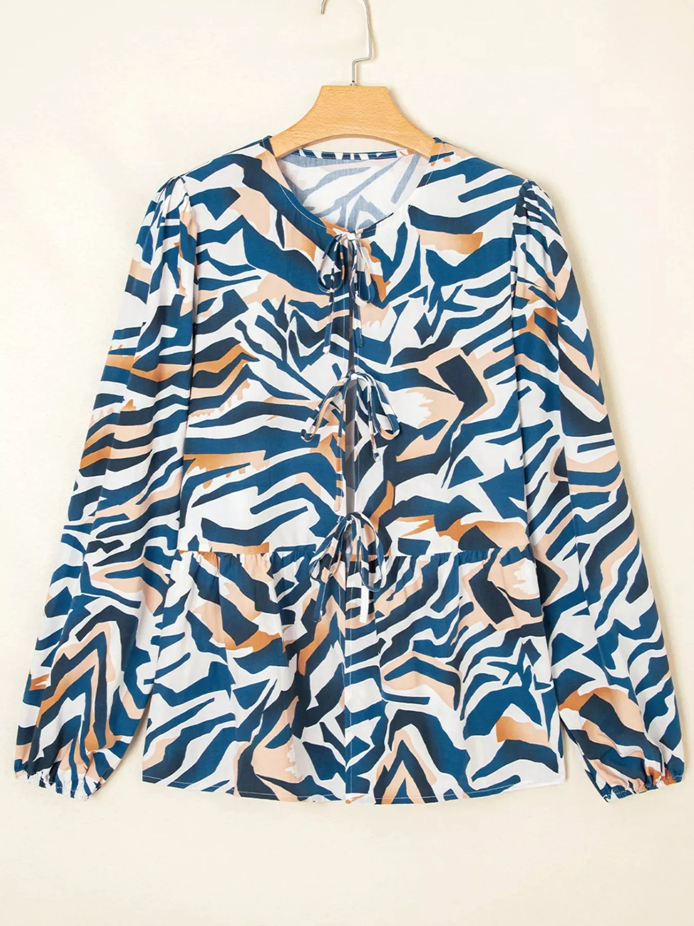 Zebra Print Tied Front Puff Sleeve Top sold by Charming Charlie product image thumbnail 2